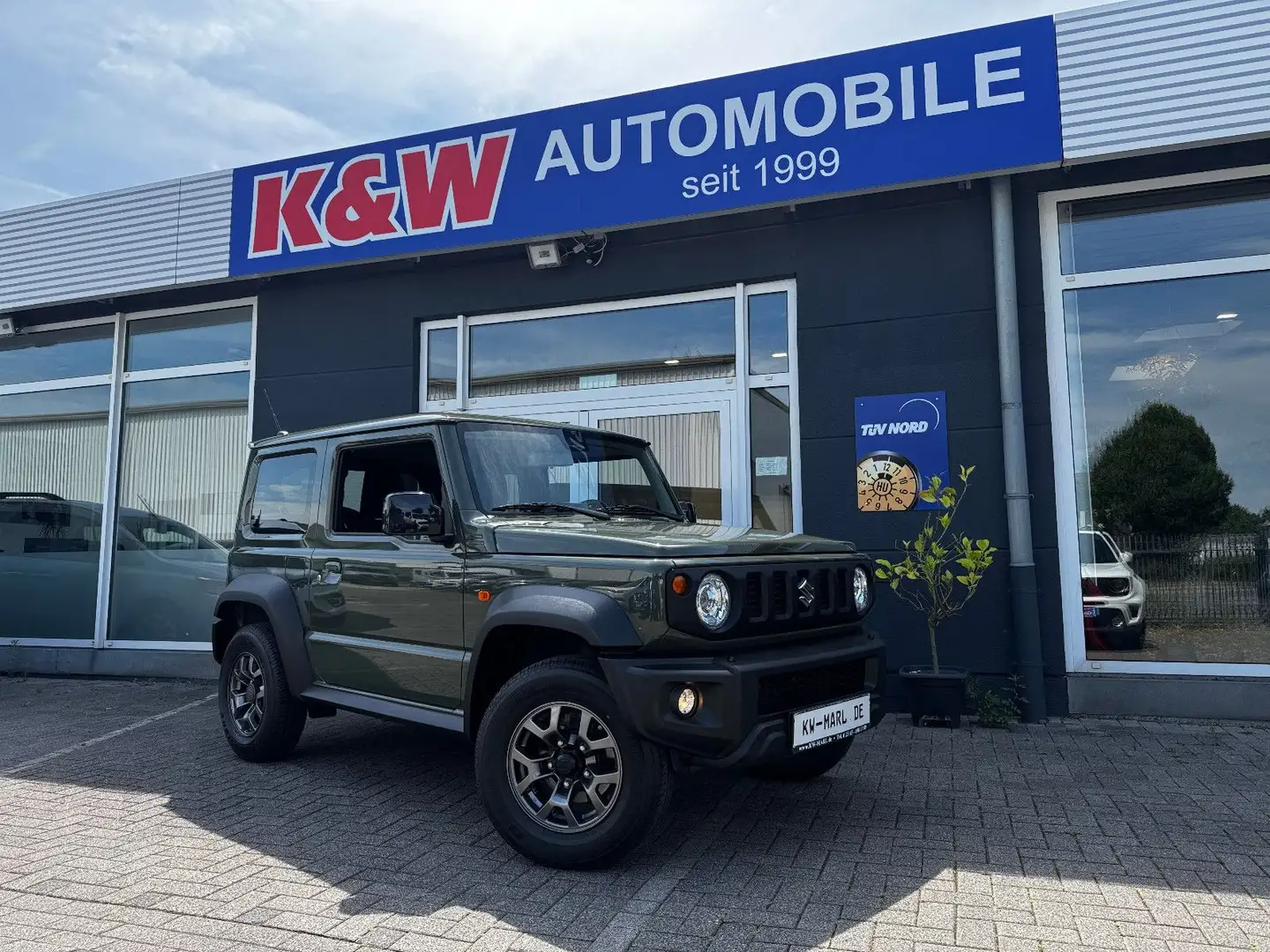 Suzuki Jimny Comfort+ AllGrip AUTOM. NAVI KLIMAAUTO AHK Vert - 1