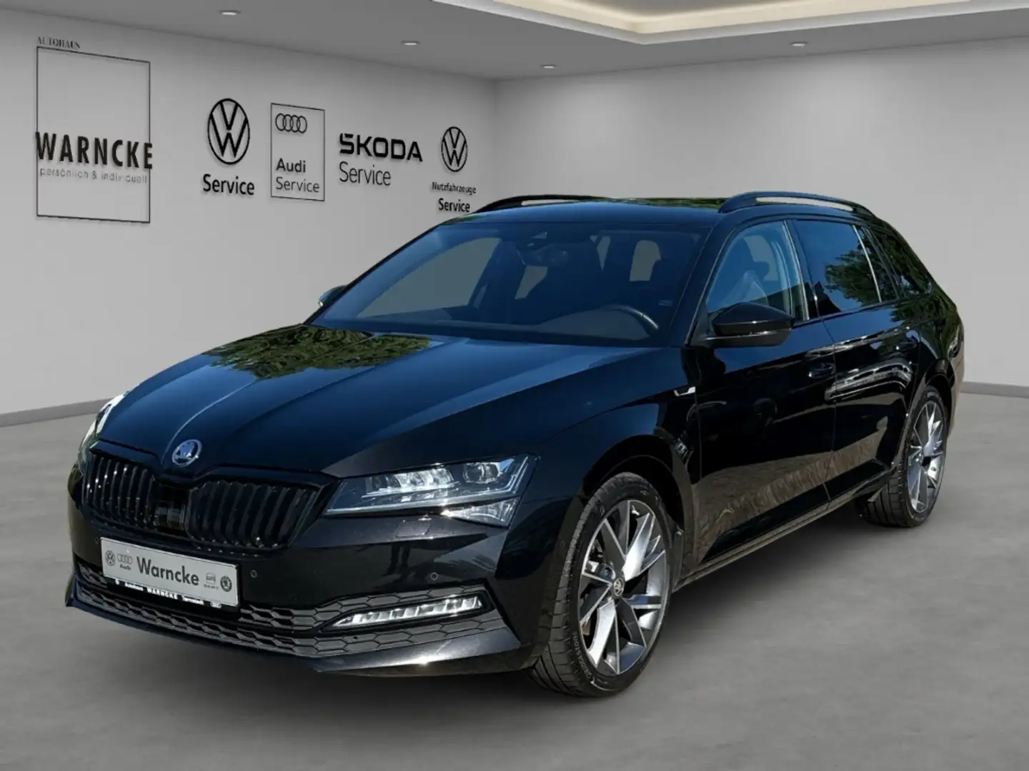 Skoda Superb Combi 2.0 TDI Sportline NAV ACC LED RFK PDC DCC Zwart - 1