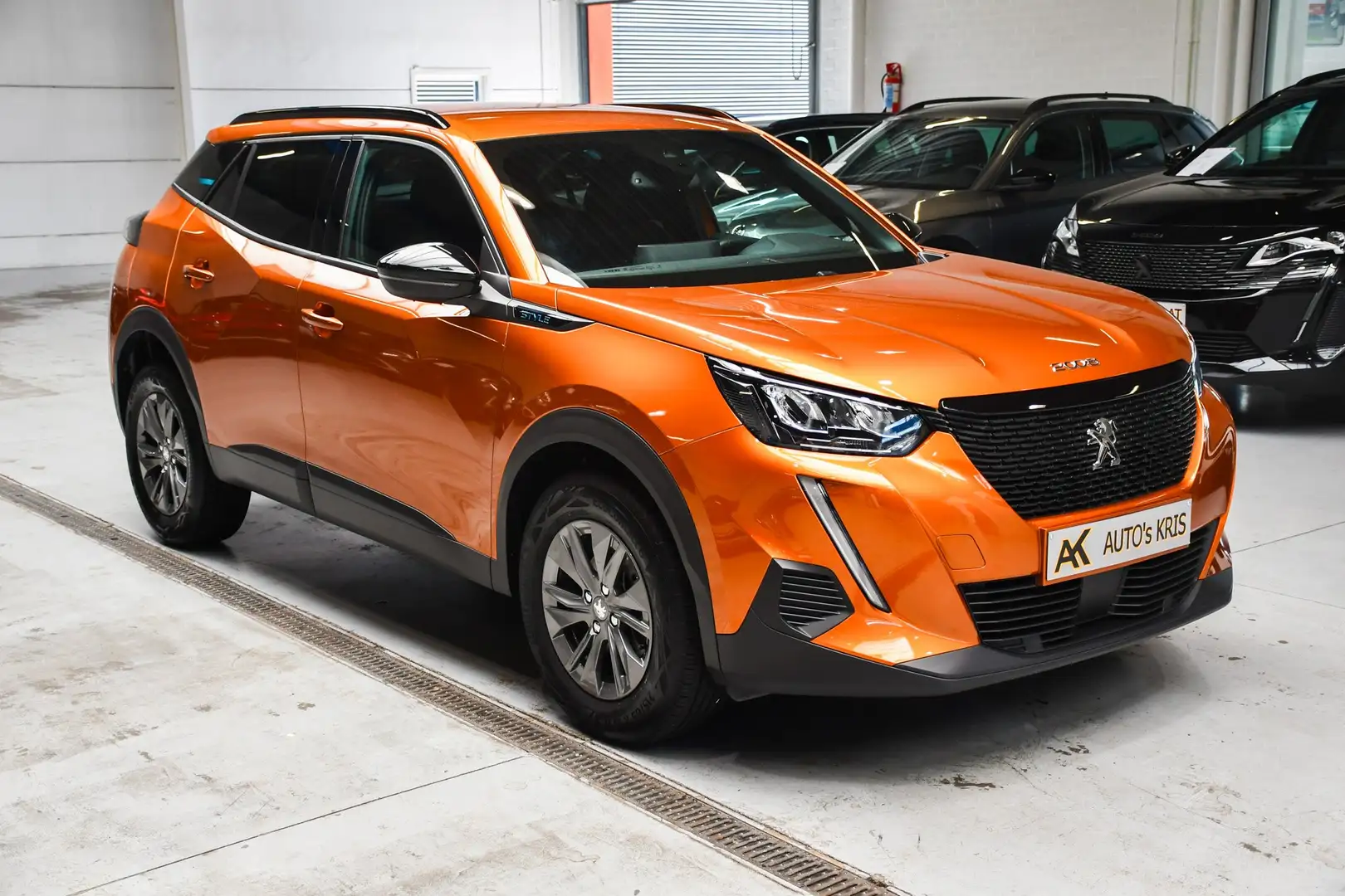 Peugeot 2008 1.2 PureTech Style - NAVI / SMARTLINK / AIRCO / CC Oranje - 2
