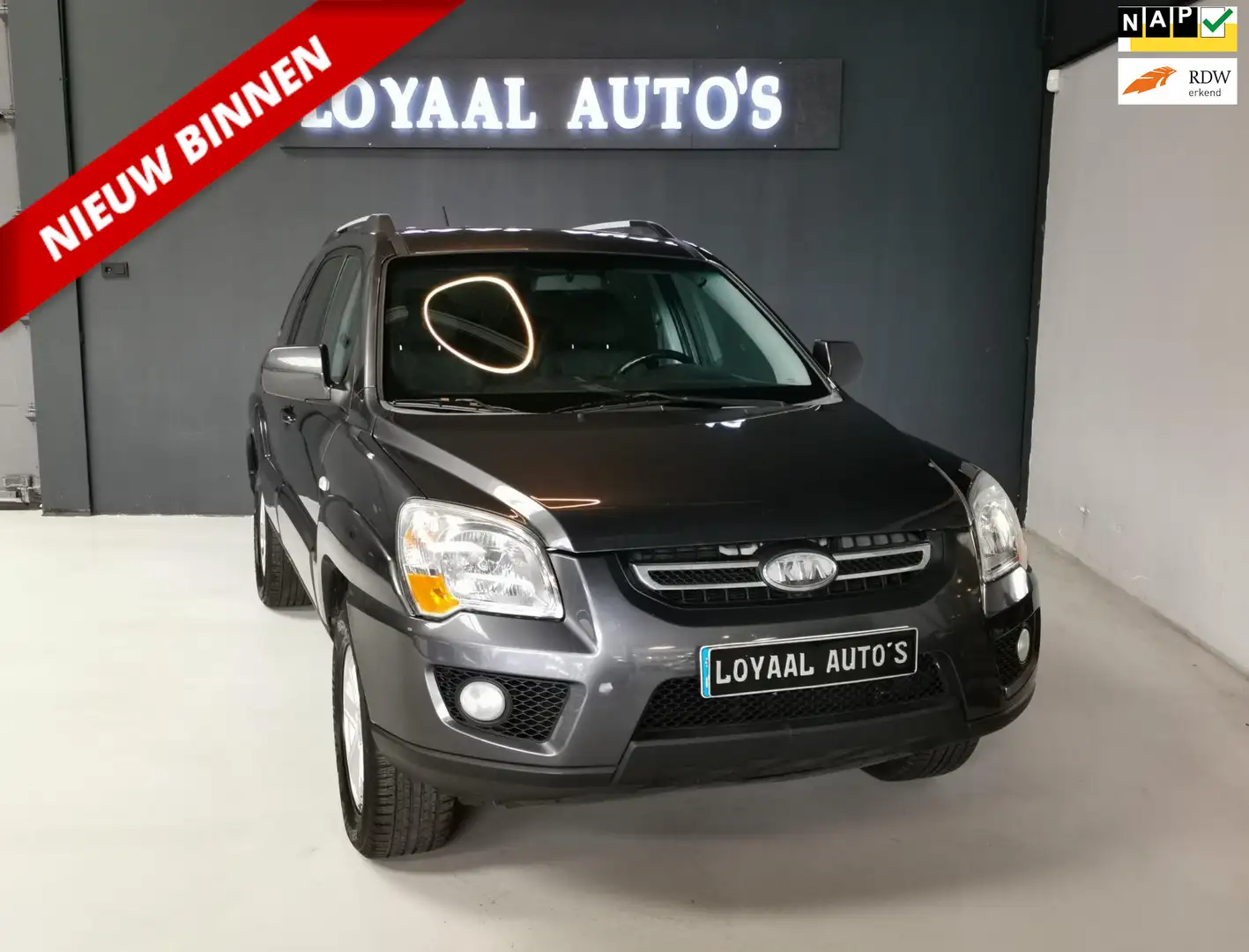 Kia Sportage 2.0 CVVT X-tra | AIRCO | CRUISE | TREKHAAK | PDC | Gris - 1
