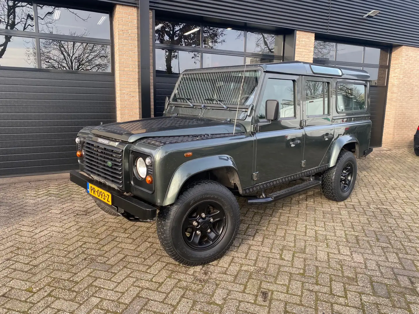 Land Rover Defender 2.5 TD5 110 SW SE 9 persoons Airco Groen - 1