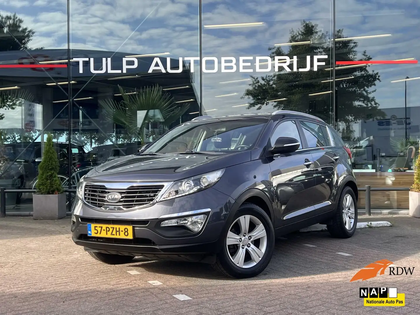 Kia Sportage 1.6 GDI ISG X-ecutive Plus Pack Navi Camera NAP Grijs - 1