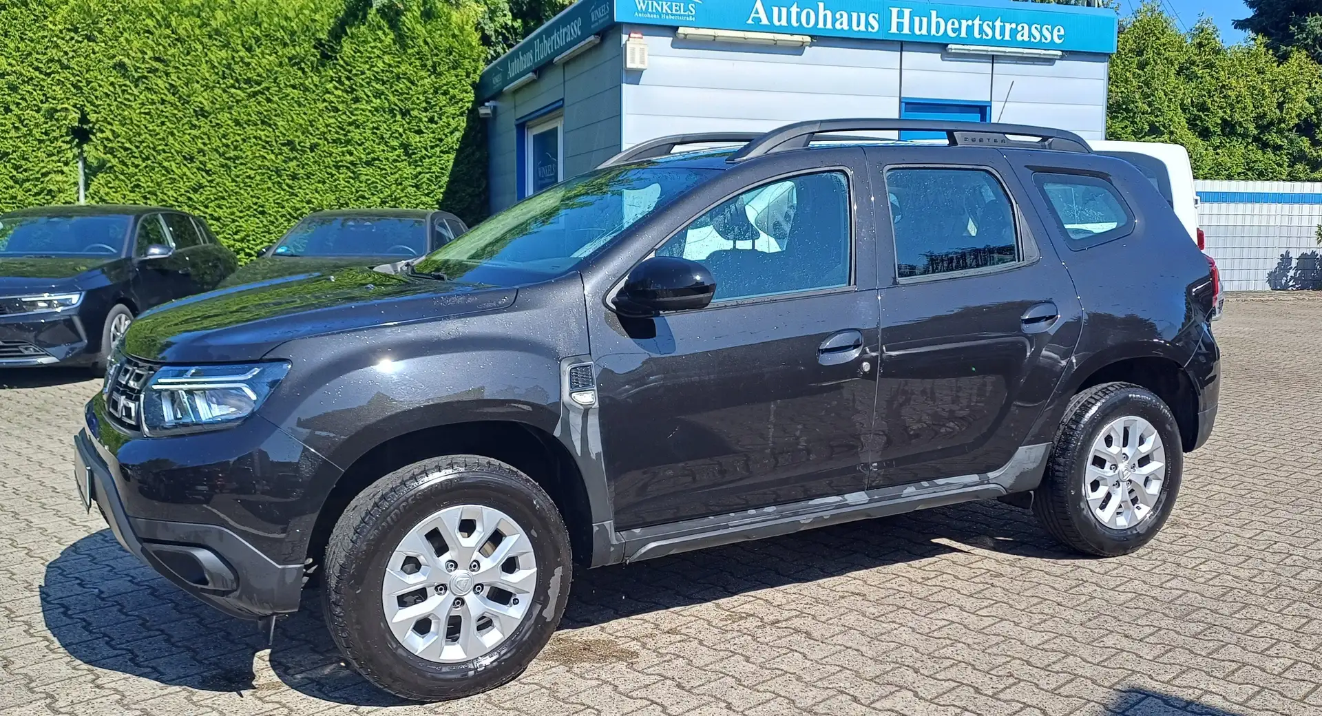 Dacia Duster Comfort Benzin/LPG-Klima-Navi-Sitzhg-8xAlu-PDC-AHK Schwarz - 1