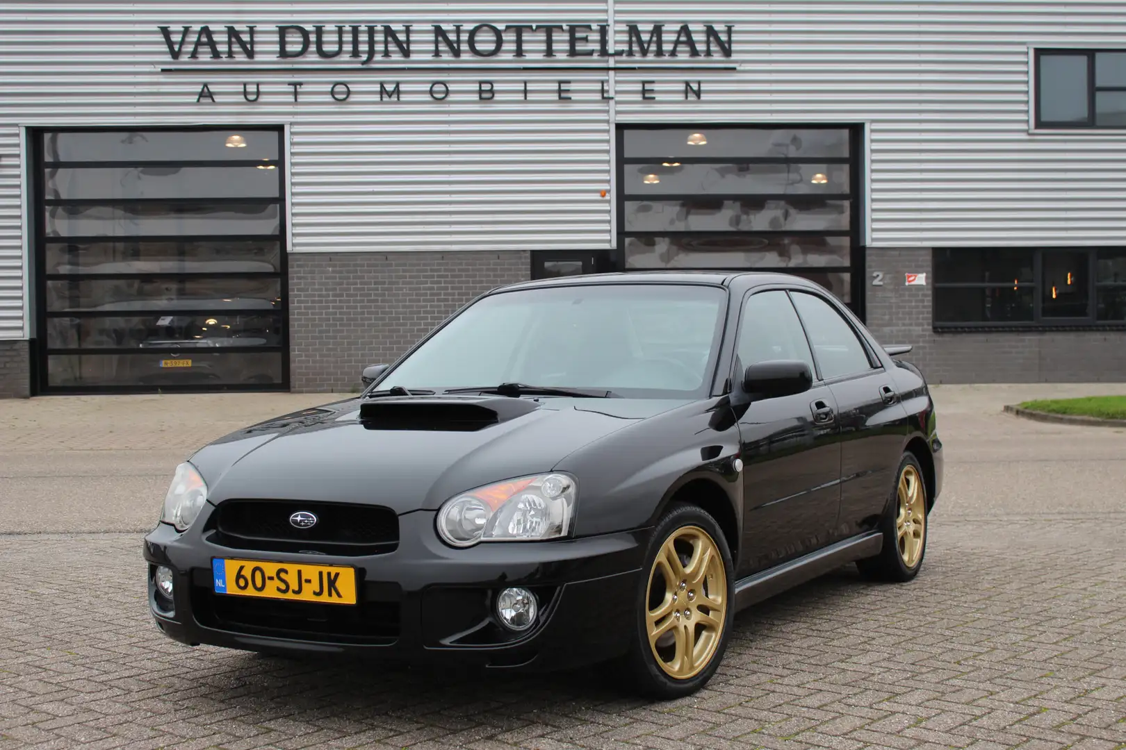 Subaru Impreza 2.0 WRX AWD / 225 PK / Clima / Carplay / N.A.P. Black - 1