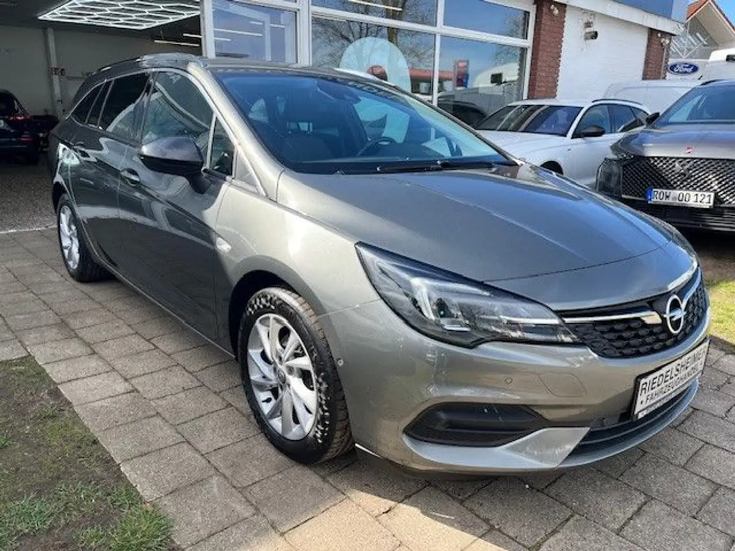 Opel Astra K Sportst. Eleg. AUT NAVI T-LEDER KAM LED Grijs - 1