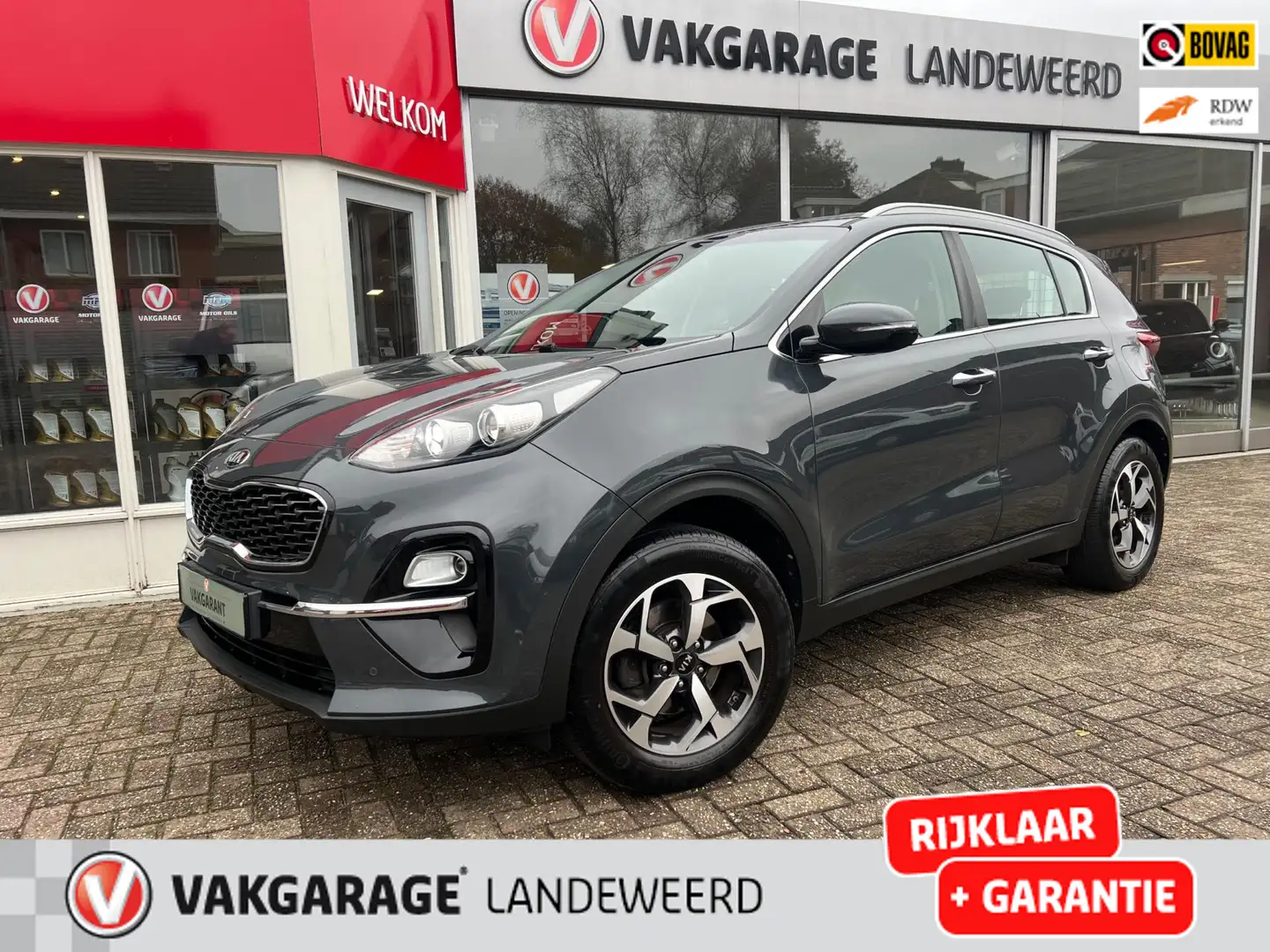 Kia Sportage 1.6 GDI DynamicLine, Navi, Cruise, 1e Eigenaar Gris - 1