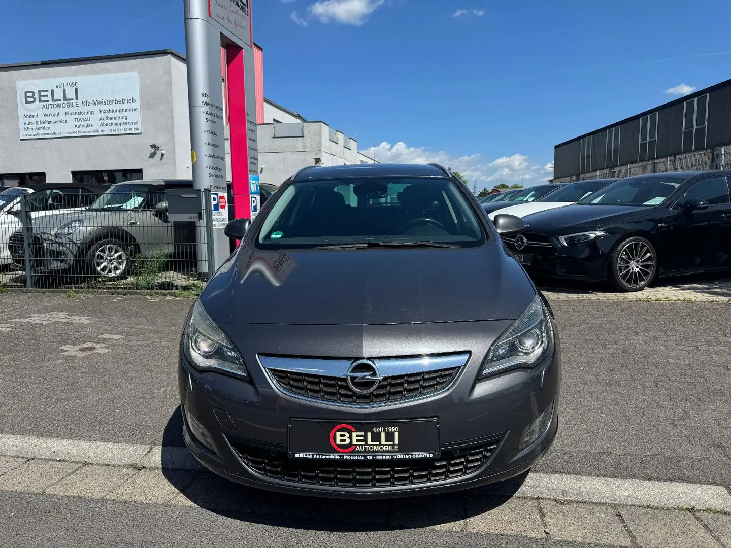 Opel Astra J 1,6 Sports Tourer Sport FINANZIERUNG Grijs - 2