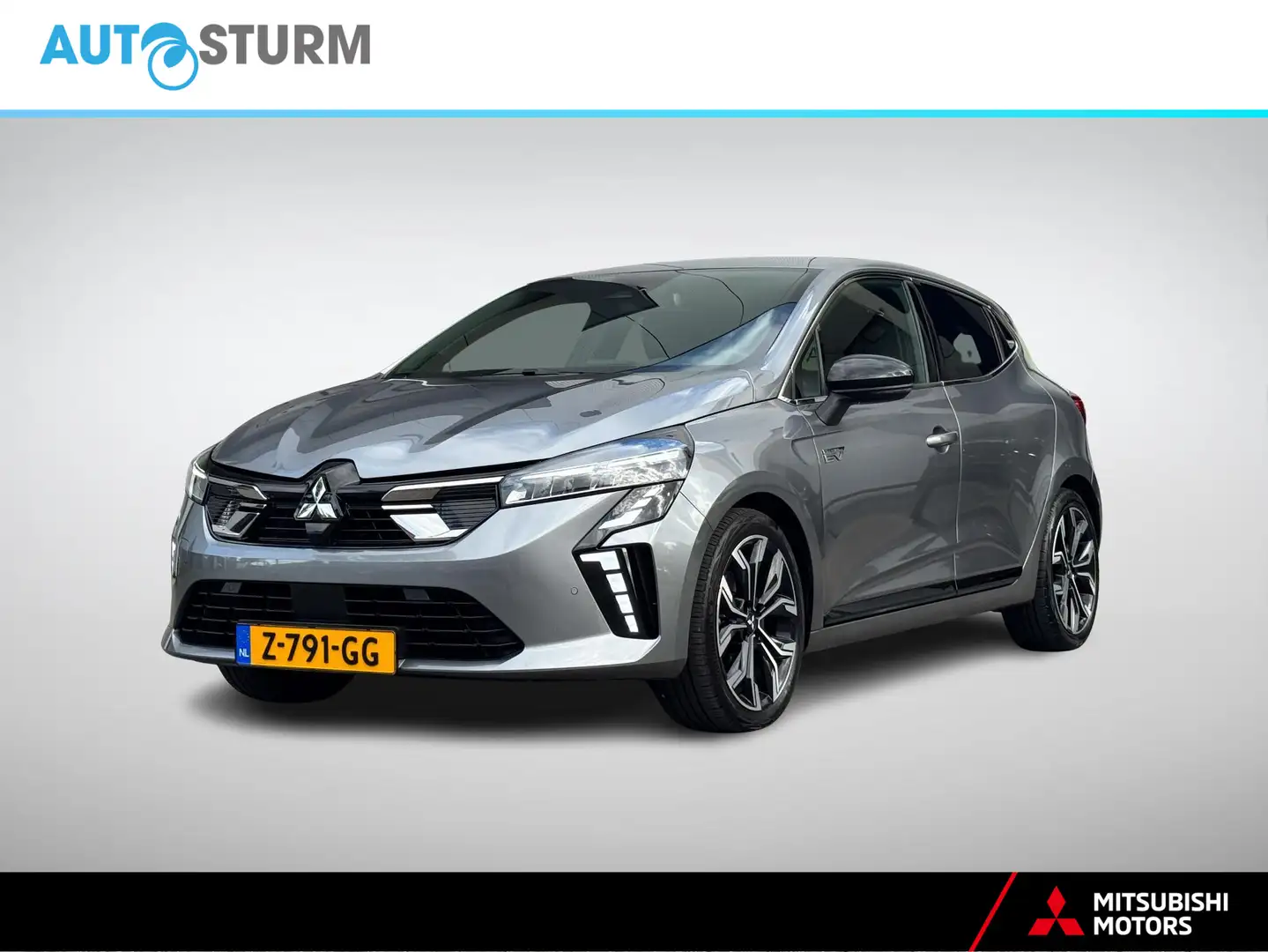 Mitsubishi Colt 1.6 HEV First Edition NL-Auto, Zeer Complete Uitvo Gris - 1