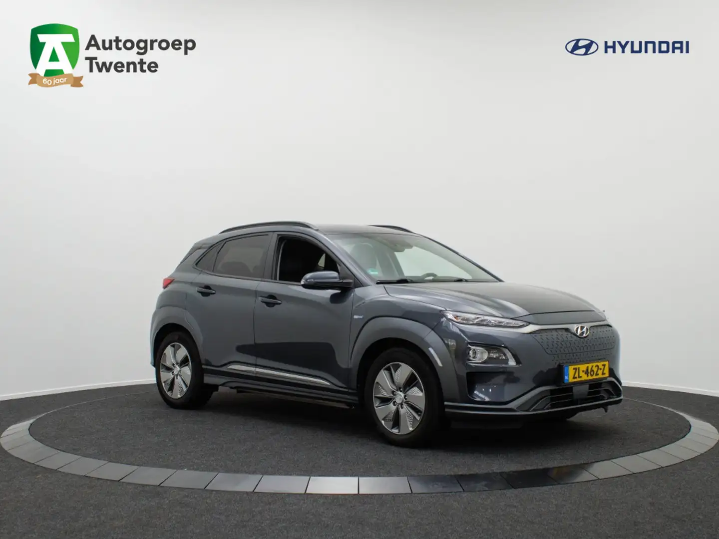 Hyundai KONA EV Premium 64 kWh | Leder | All season banden Grijs - 1