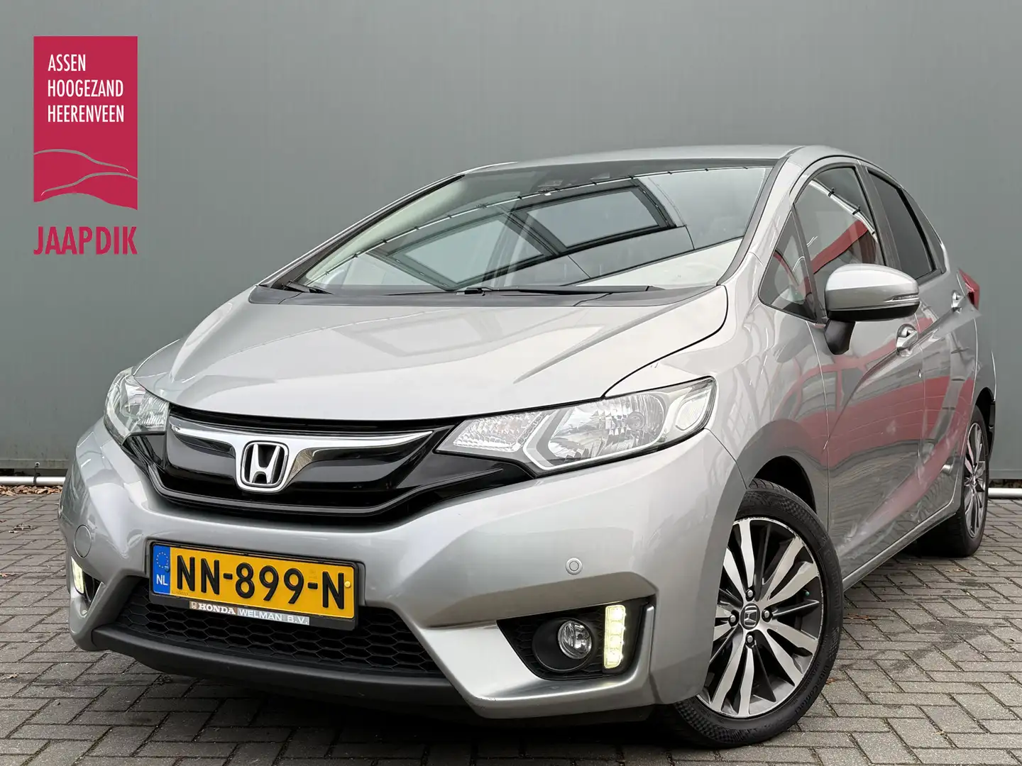 Honda Jazz BWJ 2015 1.3 i-VTEC 102 PK Elegance AUTOMAAT | TRE Grigio - 1