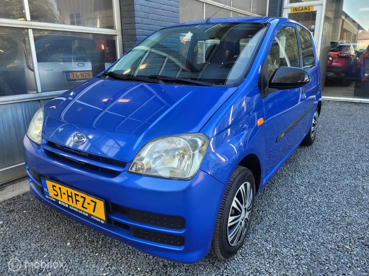 Daihatsu Cuore 1.0-12V 100th Anniversary | DOH | 27.000KM | Blauw - 1