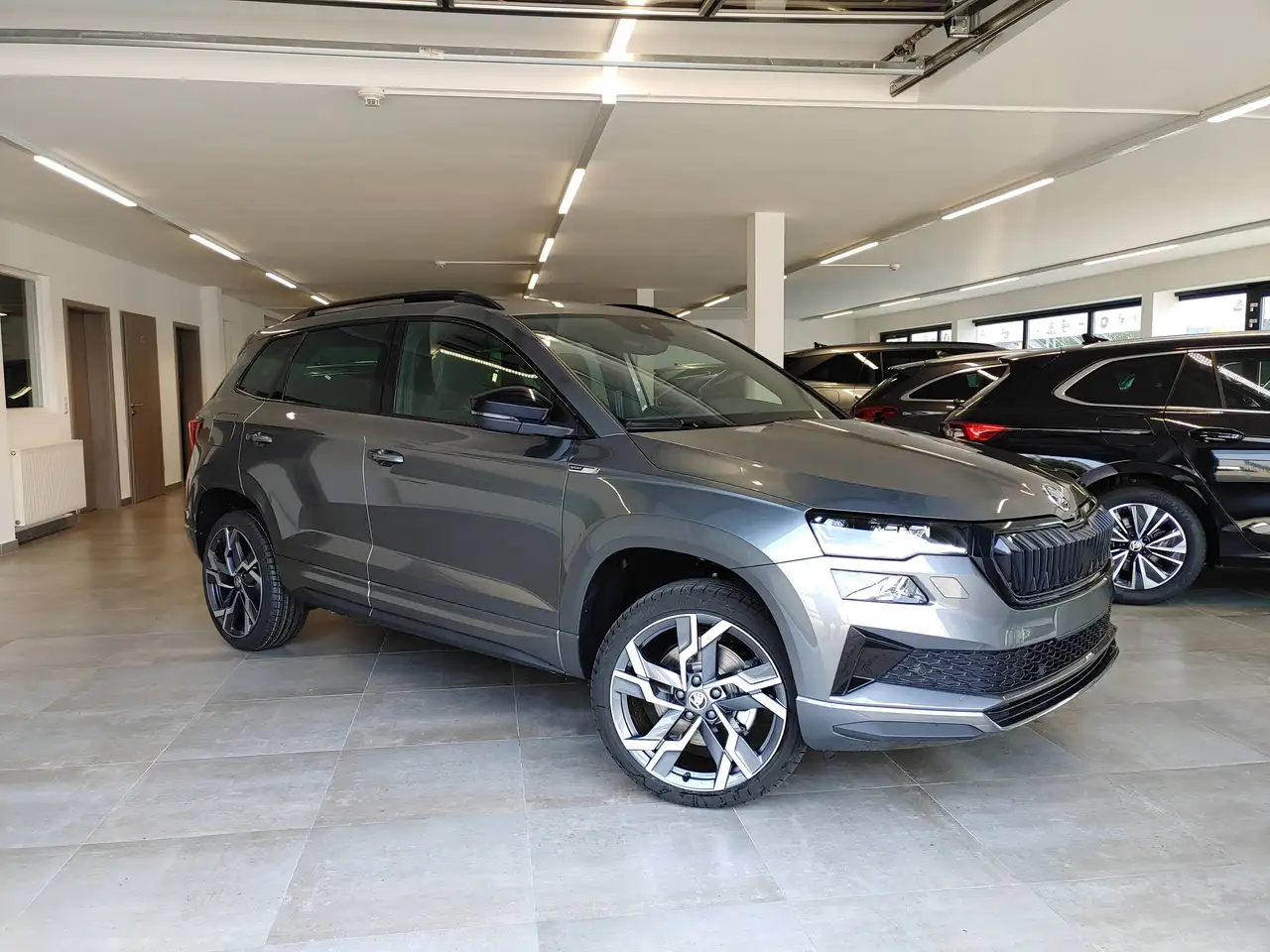 Skoda Karoq 2.0 TSI DSG 4x4 Sportline Matrix/Navi/ACC/AHK/Kamera/5Jahre — photo 1 of 15