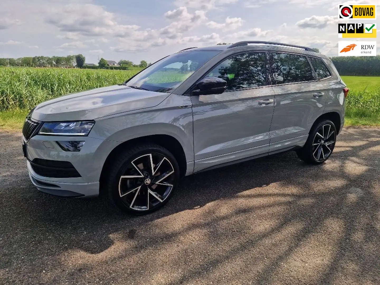 Skoda Karoq 1.5 TSI ACT Sportline Business, dealer onderhouden Gris - 1