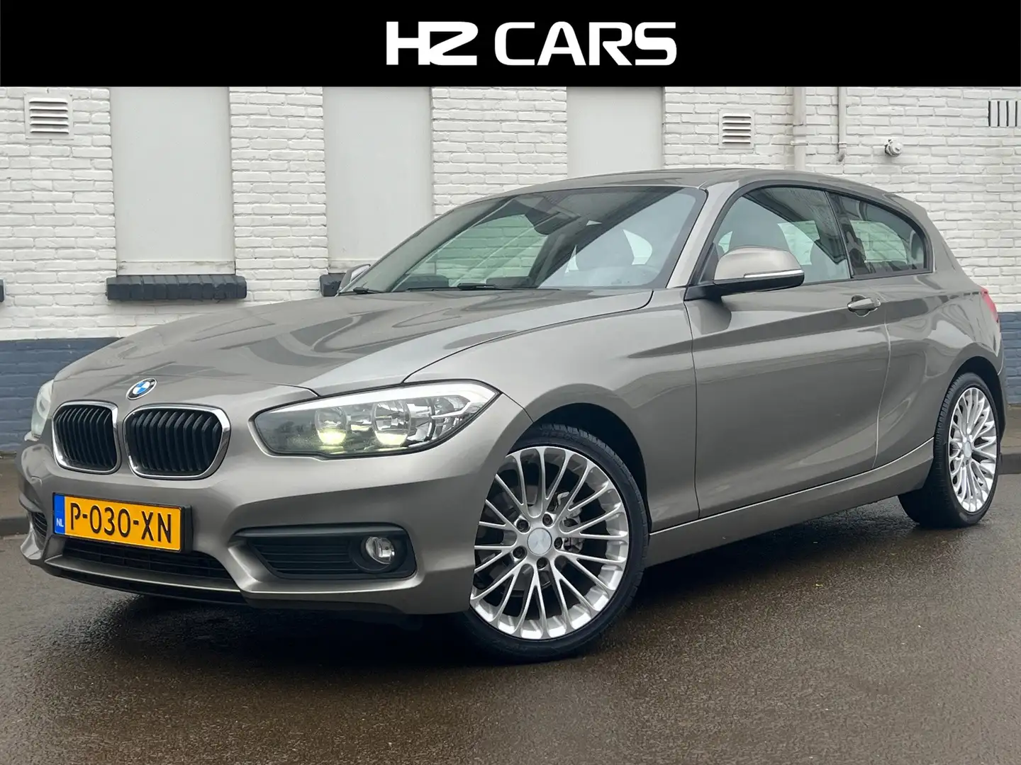 BMW 116 1-serie 116i Essential|3drs|18"|PDC|Navi|Cruise|Bl Gris - 1