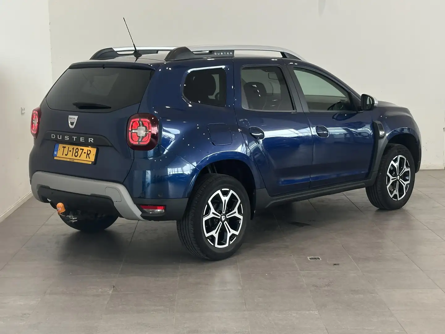 Dacia Duster 1.2 TCe 125 Prestige | Trekhaak | Navigatie | Clim Blauw - 2