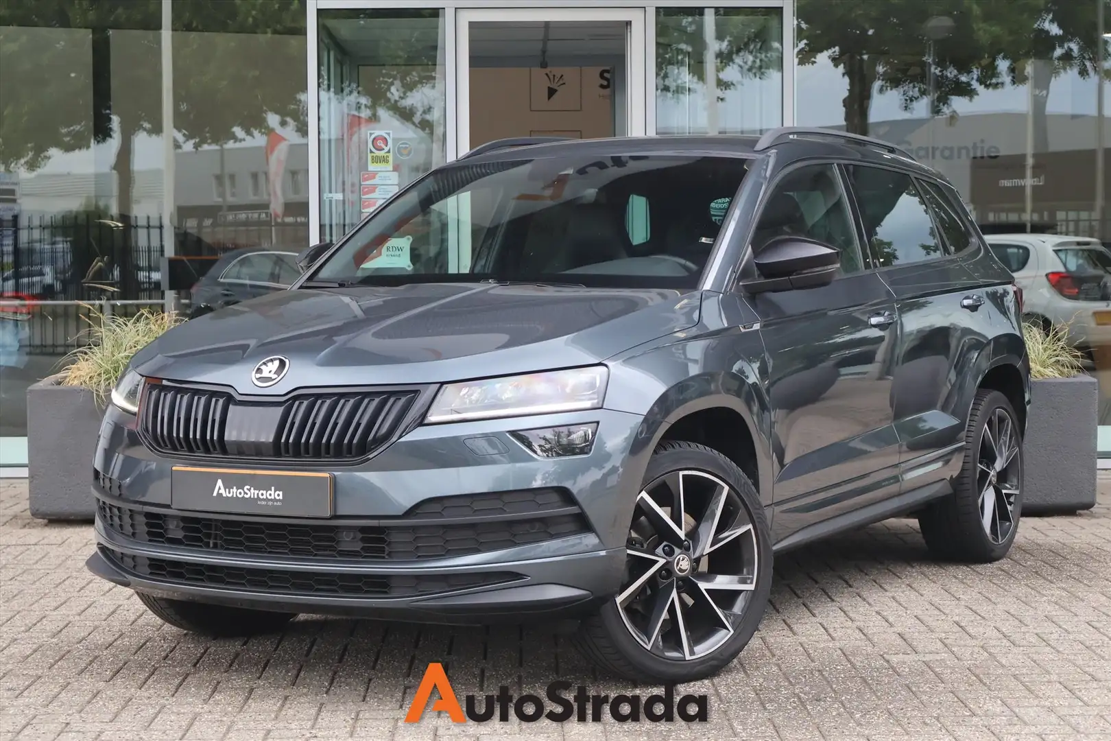 Skoda Karoq 1.5 SportLine TSI ACT 150pk | Leder | Adaptive | C Gris - 1