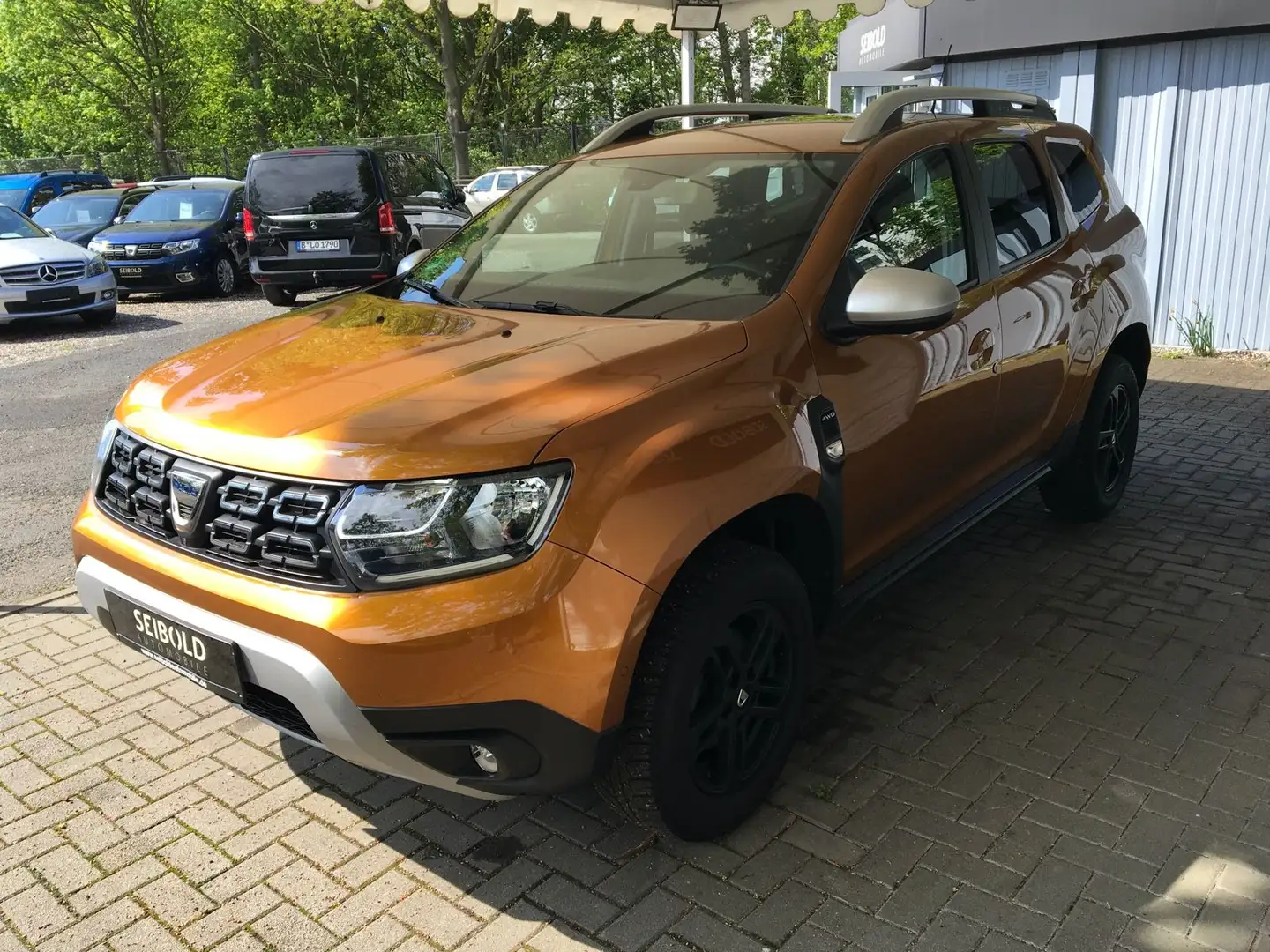 Dacia Duster II 1.2TCe Prestige 4WD/1.Hd/Navi/360°/PDC Gold - 1