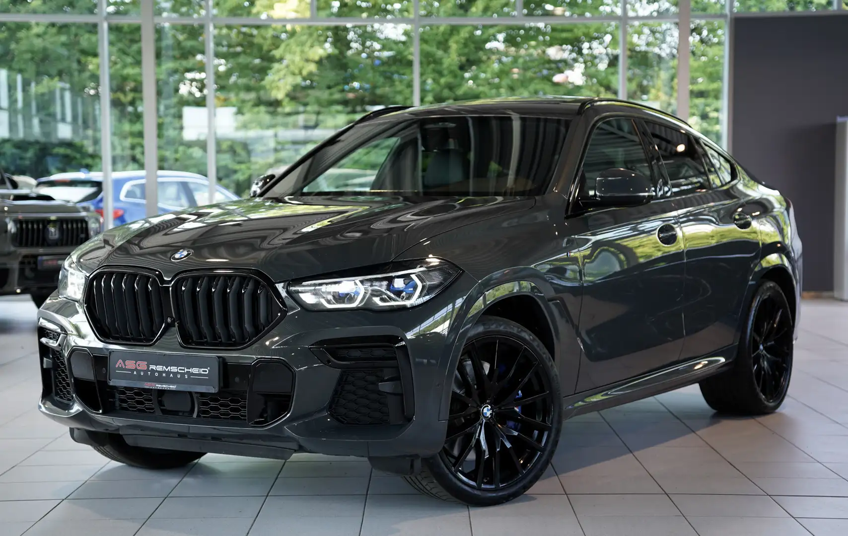 BMW X6 M i *1.H *22 *H-UP*Laser*AHK*H&K*SkyLounge Grau - 1