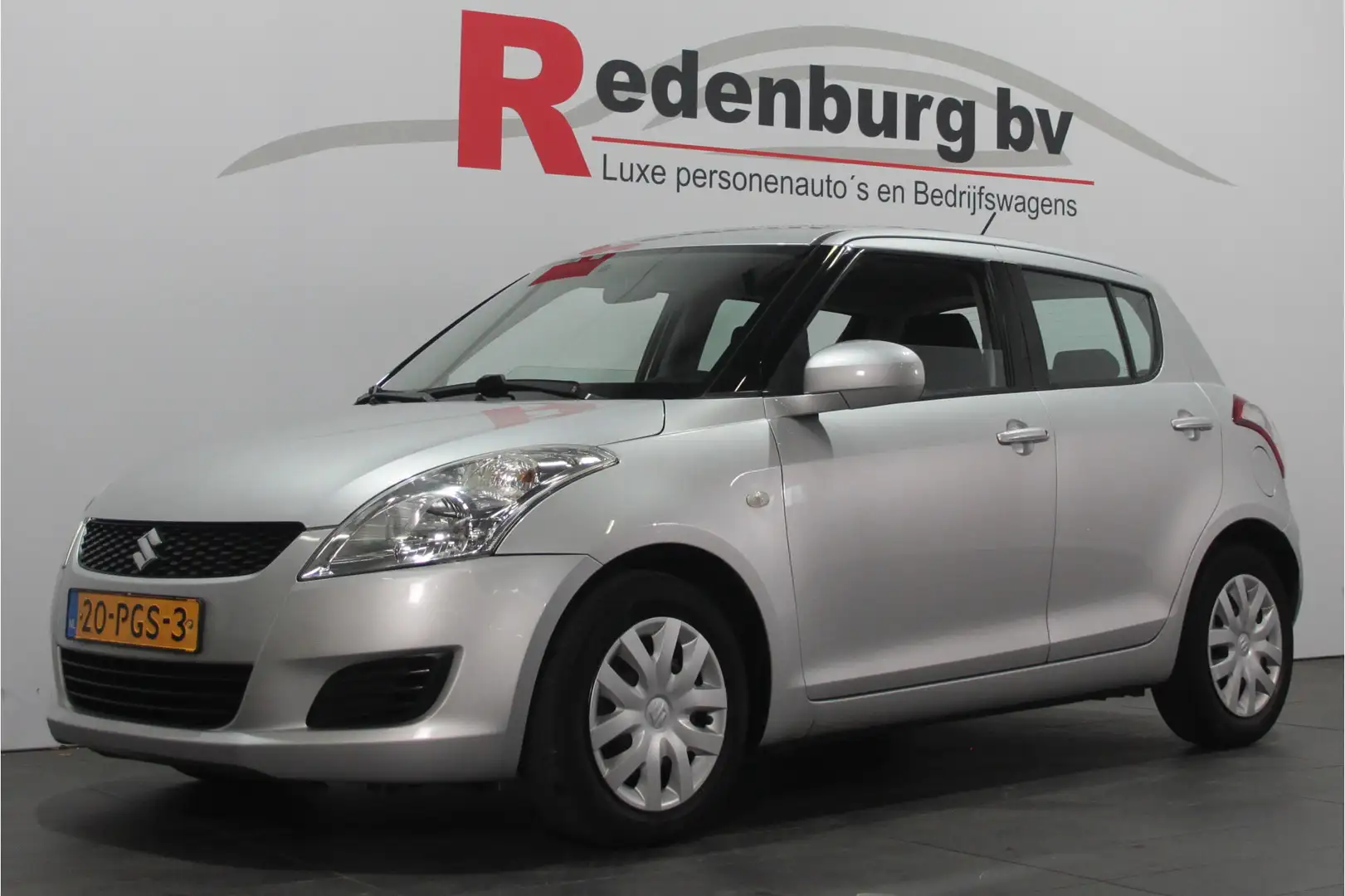 Suzuki Swift 1.2 Comfort EASSS - 5 drs. - Airco / Stoelverw. Gris - 1
