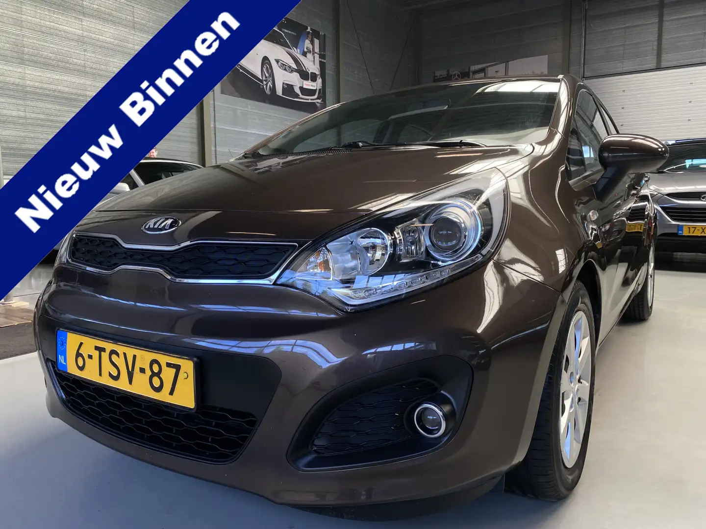 Kia Rio 1.2 CVVT BusinessLine Airco, Cruise, 5drs Braun - 1