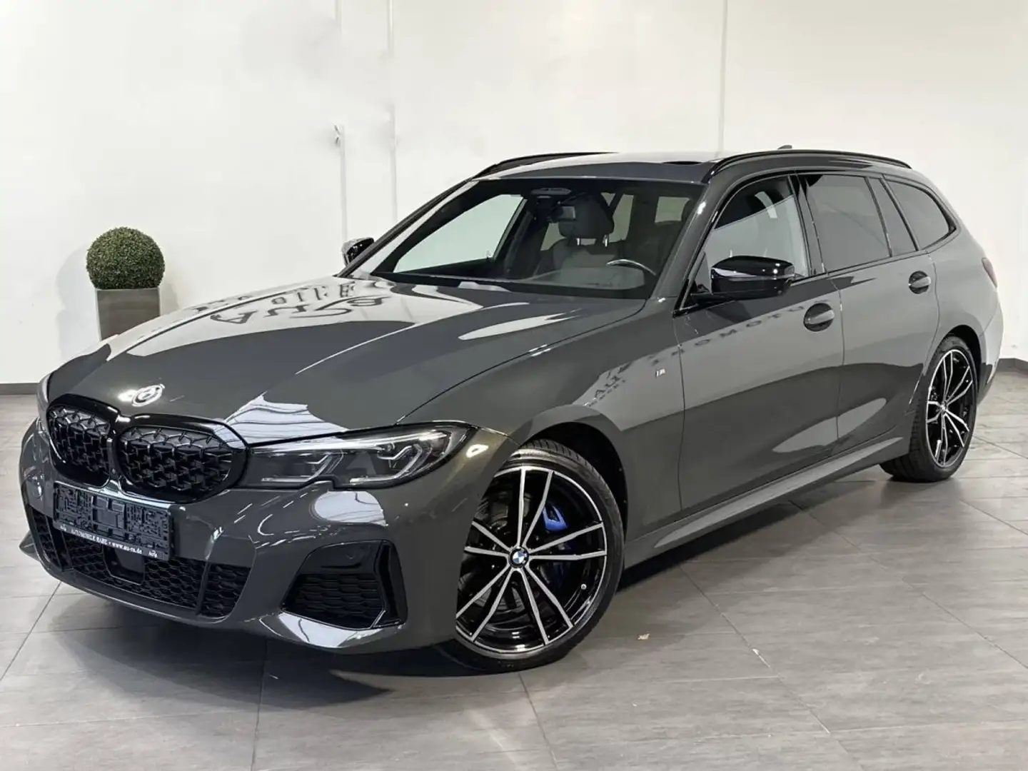 BMW 340 M340d Touring xDrive NAV+LASER+AHK+HUD+PANO+360° - 1