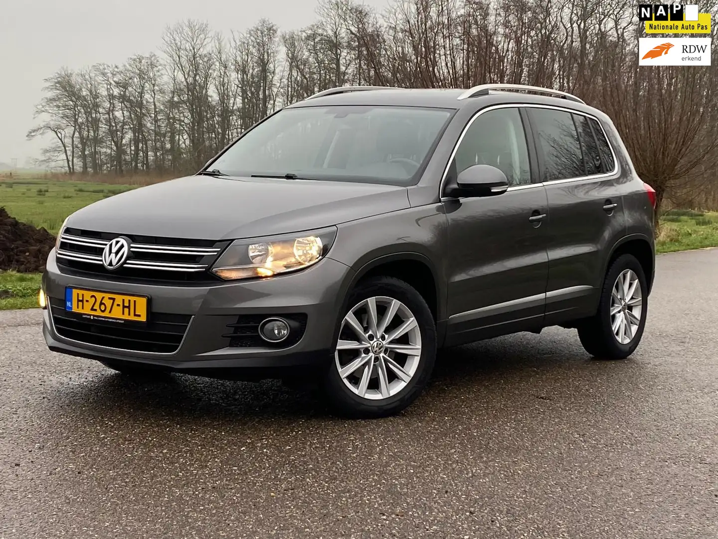 Volkswagen Tiguan 1.4 TSI Highline 5DRS NAVI CAMERA AIRCO NAP GOED O Grijs - 1
