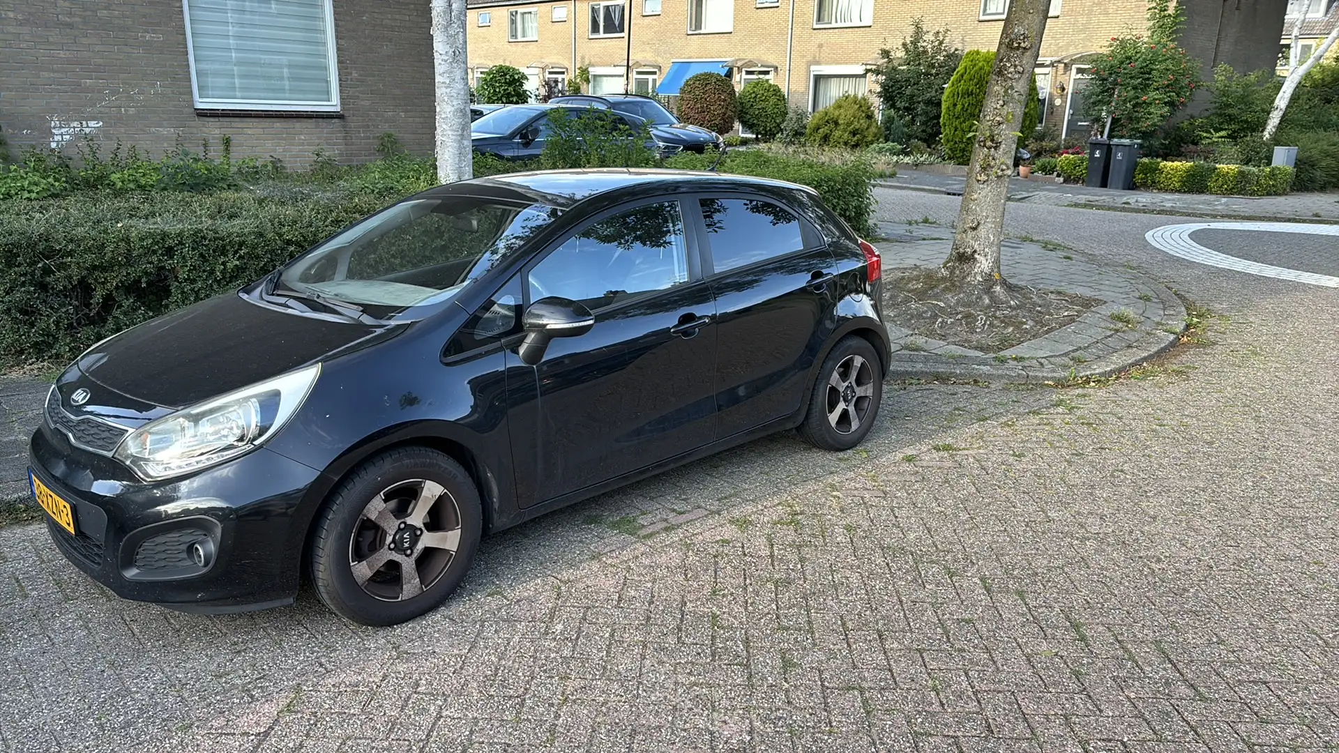 Kia Rio 1.2 CVVT Plus Pack Zwart - 1