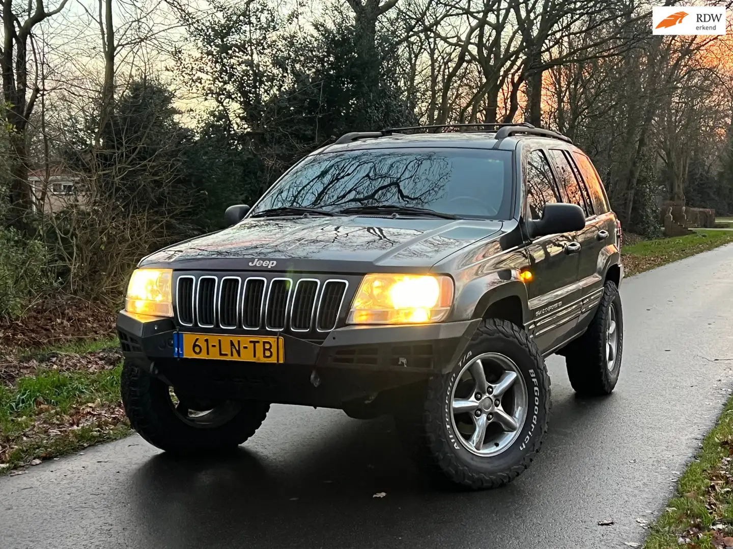 Jeep Grand Cherokee 4.0i Limited | Nieuwe APK + Leder + Automaat Nu € Zwart - 1