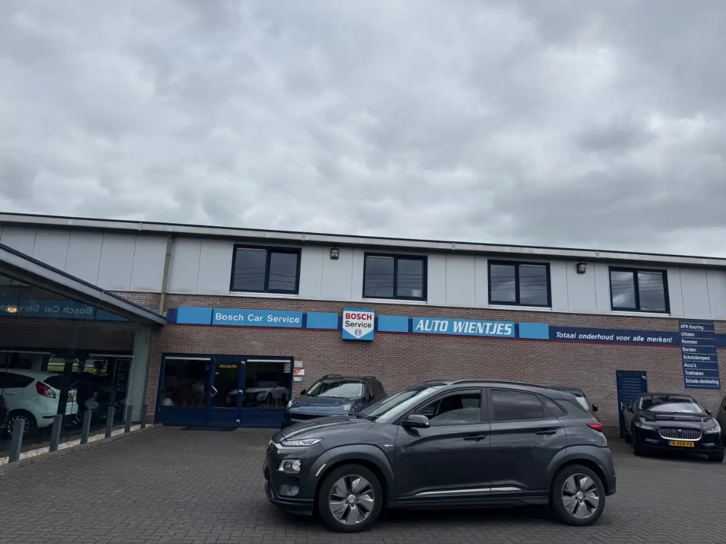 Hyundai KONA EV Premium 64kWh | Leer | Navi Grijs - 1