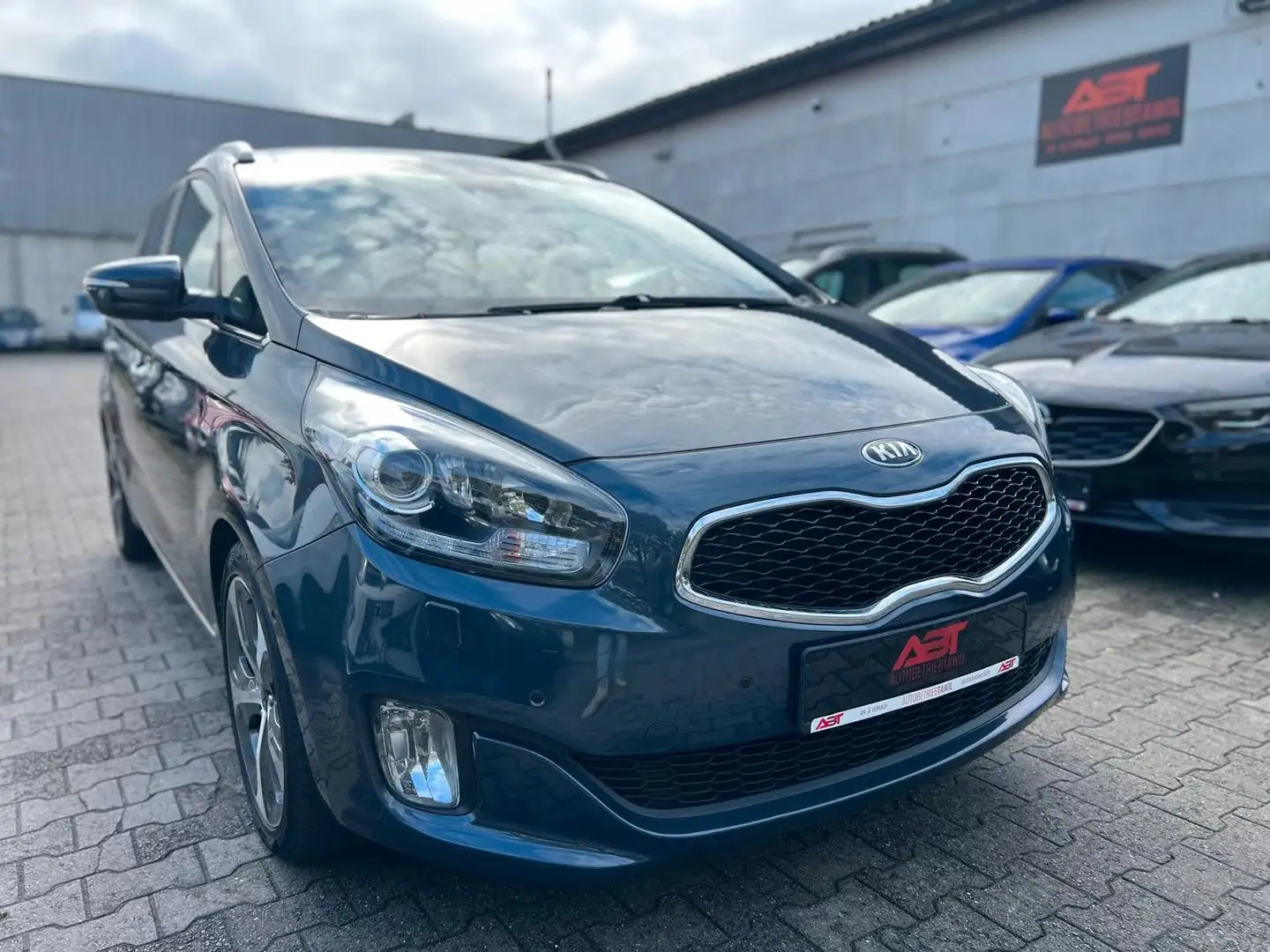 Kia Carens 1.7 CRDI,TÜV NEU,Navi,PDC,Kamera,7Sitzer Blau - 1