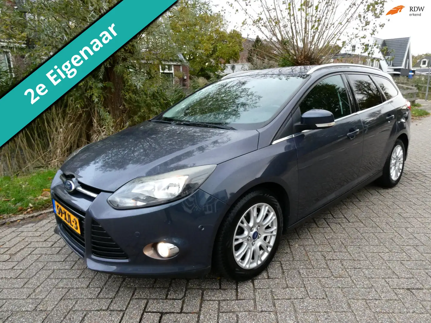 Ford Focus Wagon 1.6 EcoBoost 150pk Titanium Clima Navi Trekh Gris - 1