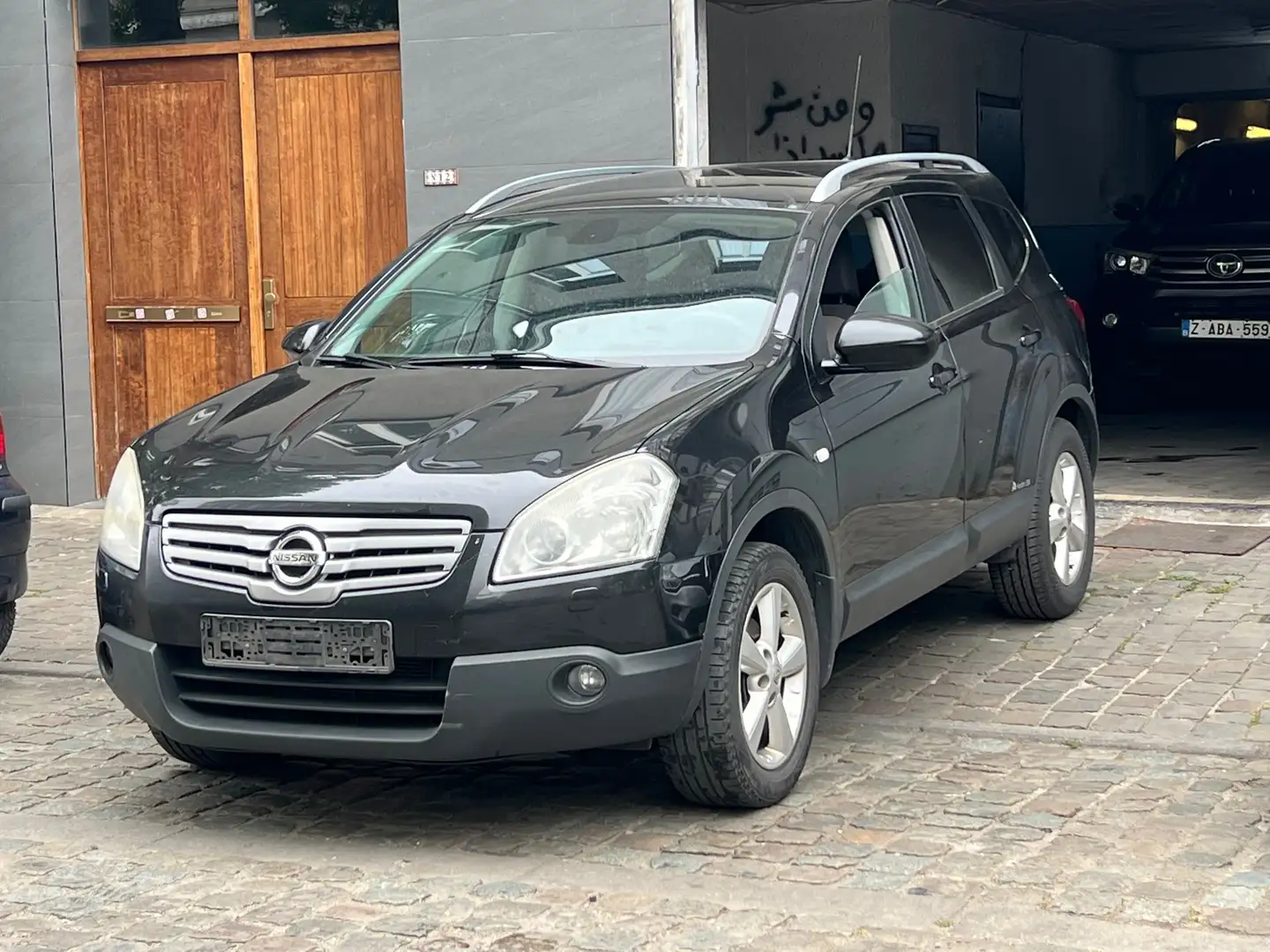 Nissan Qashqai+2 2.0i 4WD Tekna Zwart - 1