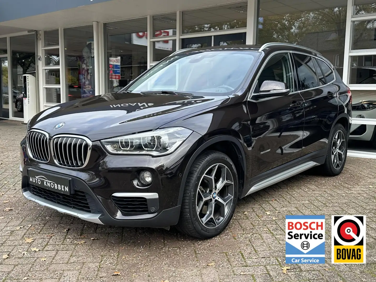 BMW X1 sDrive18i xLine Led, Navi, Camera, Climat, Bluetoo Bruin - 1