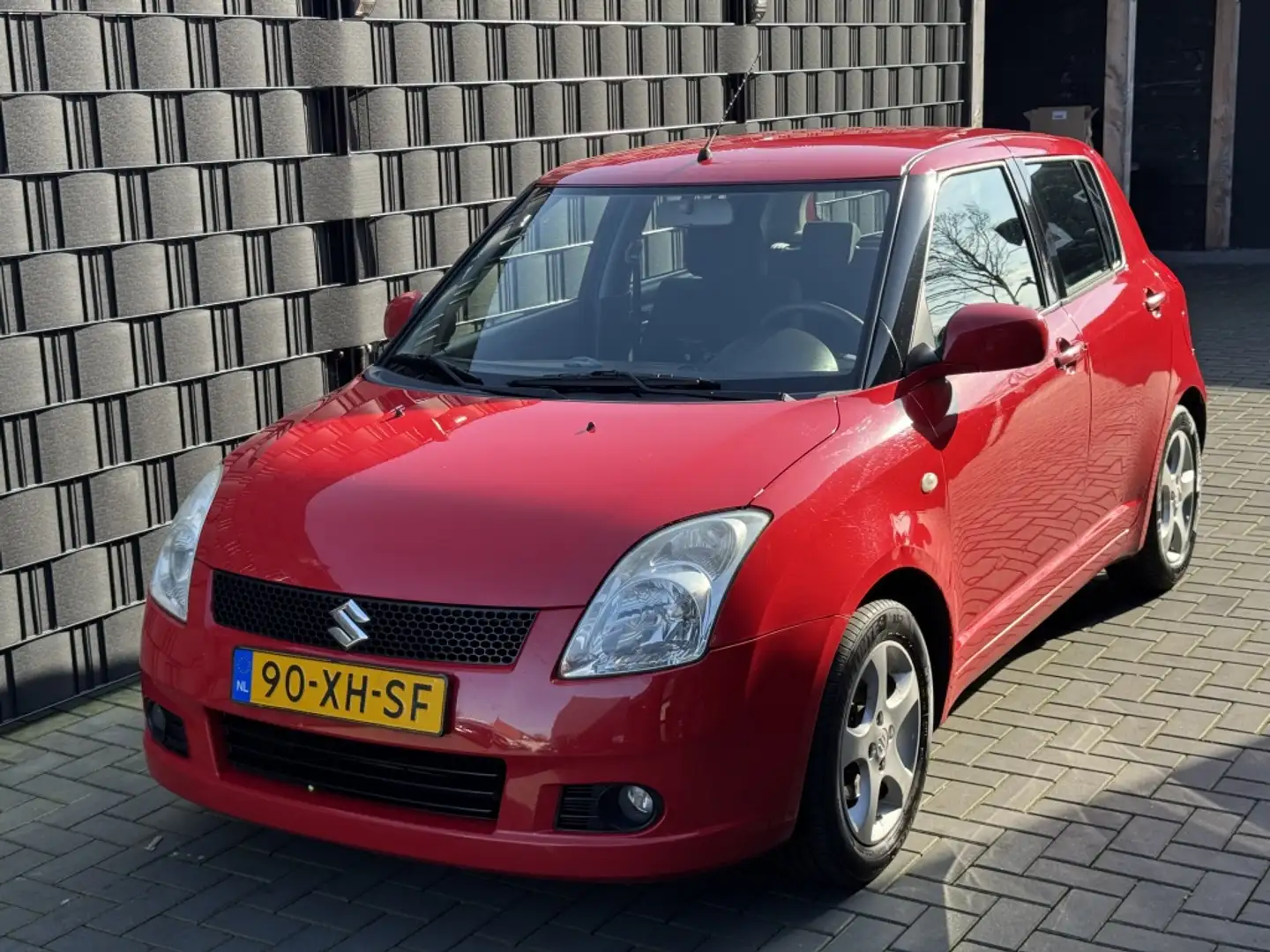 Suzuki Swift 1.5 Exclusive| 5DRS| AIRCO| LM| NAP| NIEUWE APK Rojo - 1