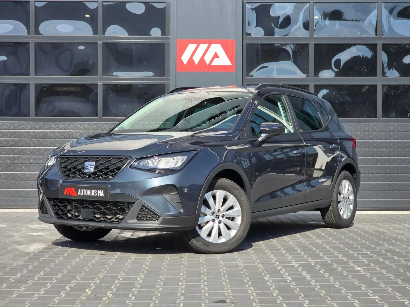 SEAT Arona 1.0 EcoTSI Style Cruise/PDC/Navi/Carplay Grijs - 1