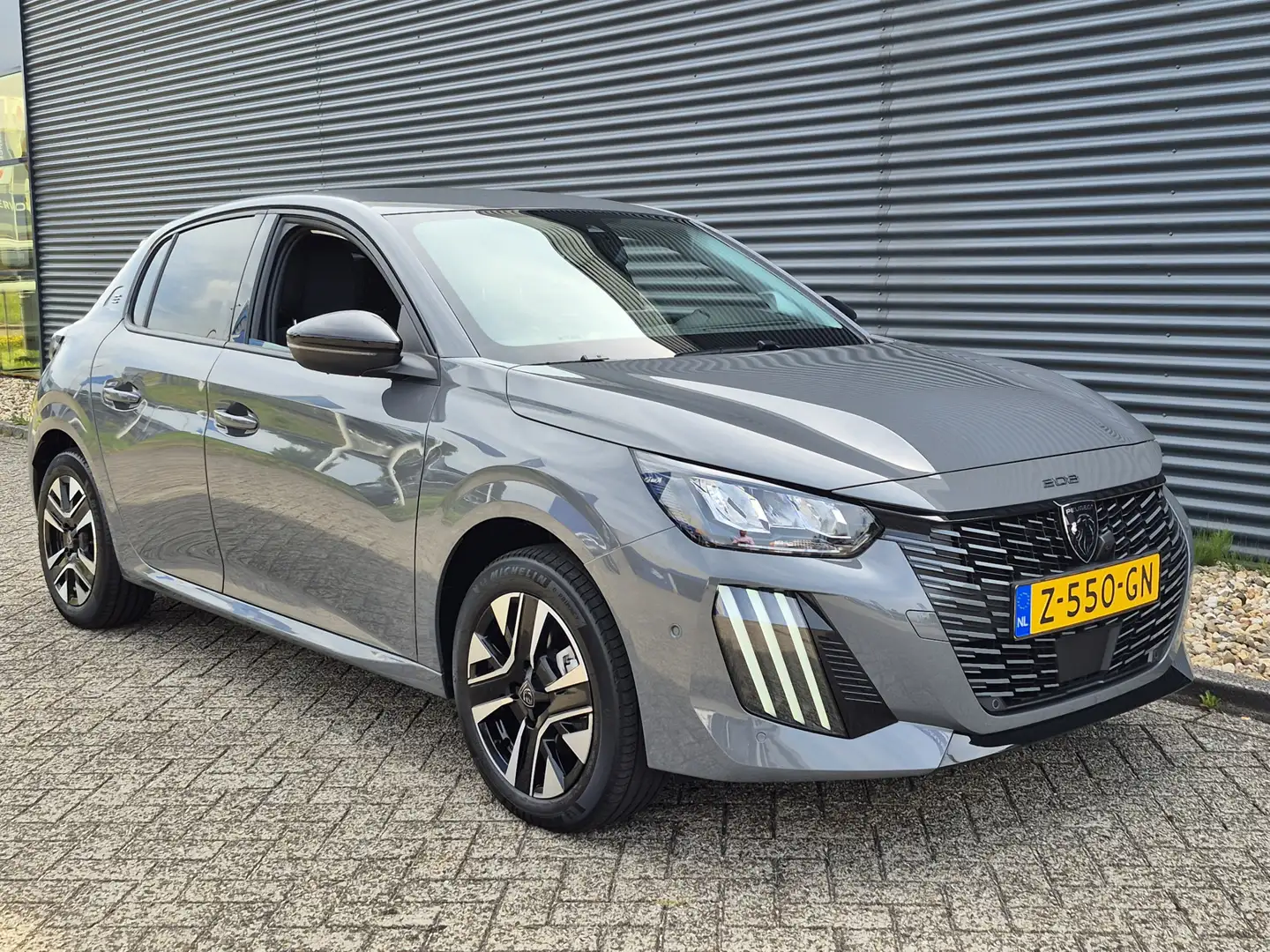 Peugeot e-208 EV Allure 51 kWh 3-Fase | Navigatie | Camera voor Grijs - 2