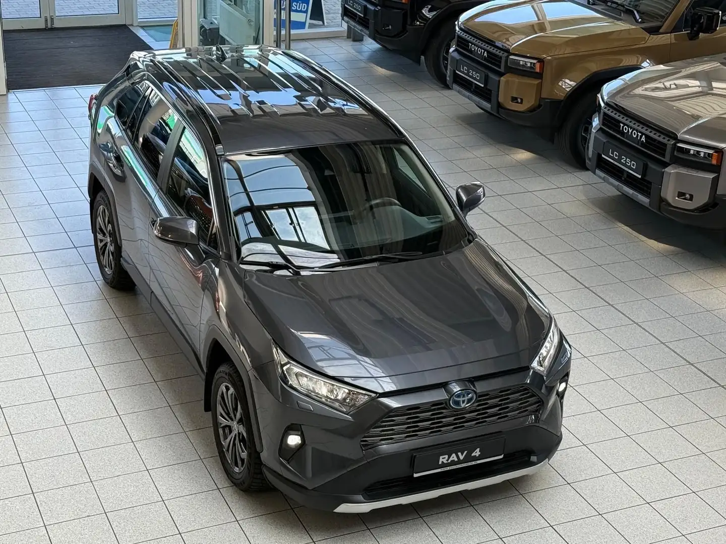 Toyota RAV 4 HYBRID-4x4-LED-LEDER-KAMERA-18 ZOLL-28.490 Grijs - 1