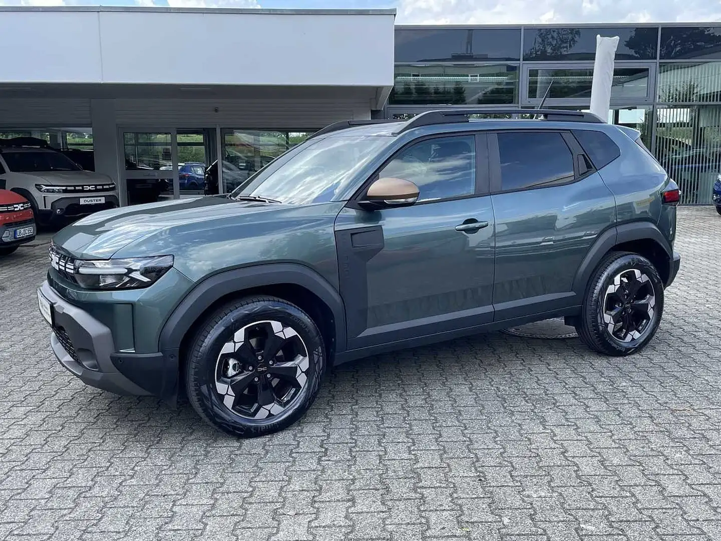 Dacia Duster Hybrid 140 Extreme neuwertig Grün - 1