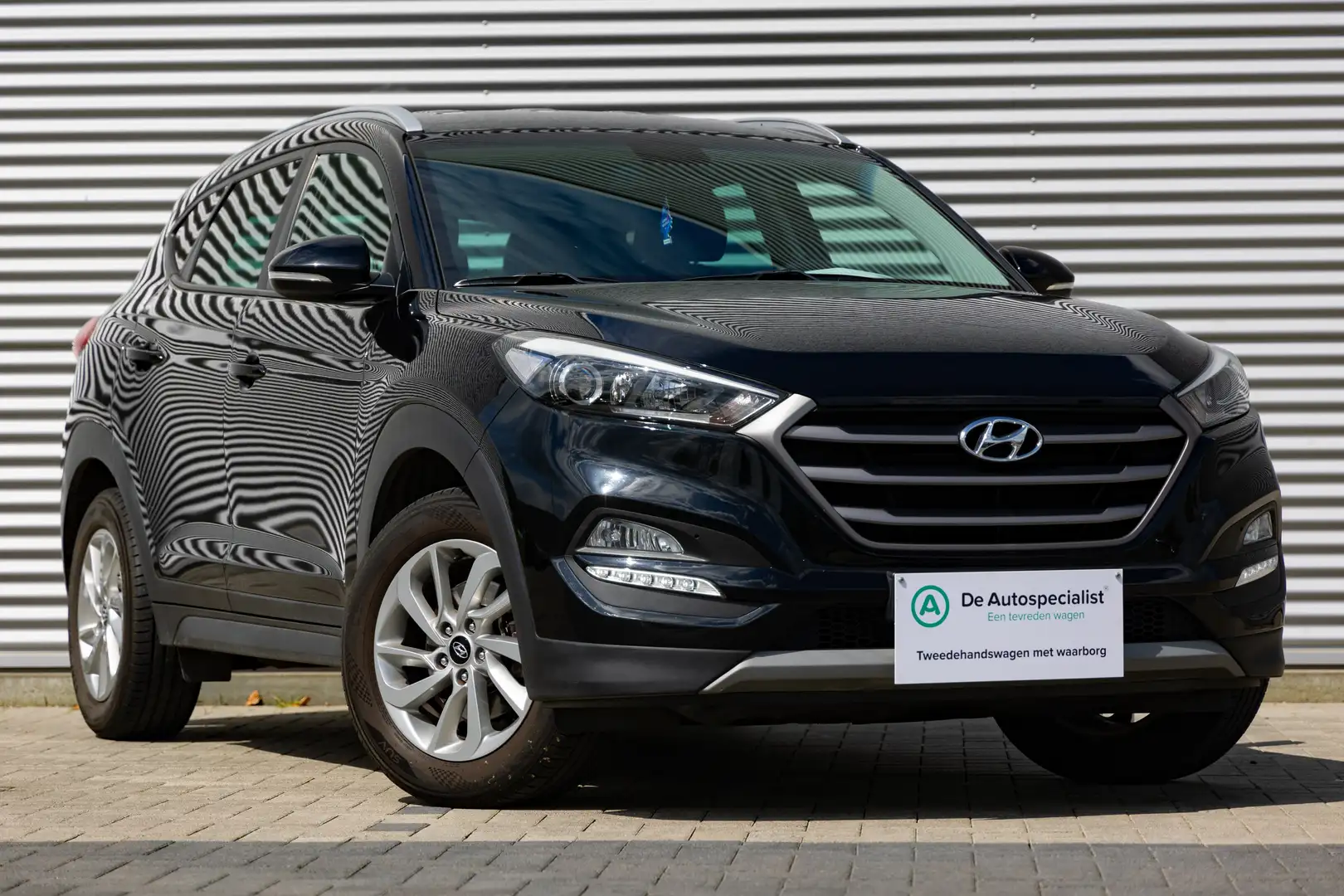 Hyundai TUCSON 1.6 GDi 2WD Premium ISG Zwart - 1