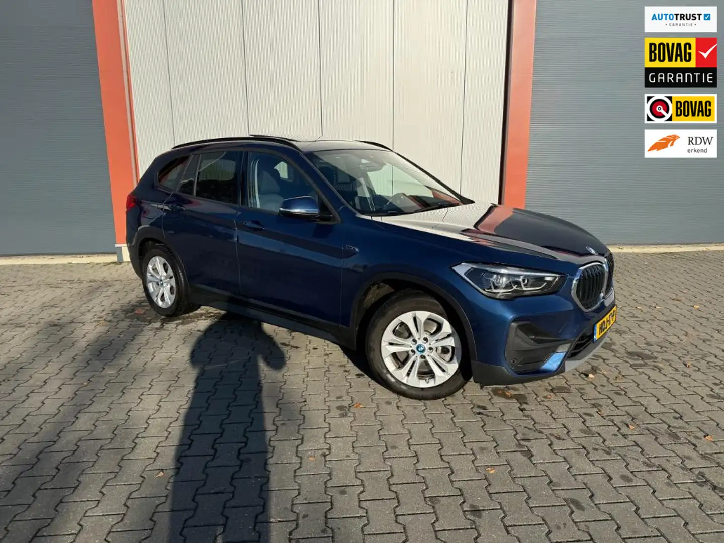 BMW X1 XDrive25e High Executive | Pano| Trekhaak Blauw - 1