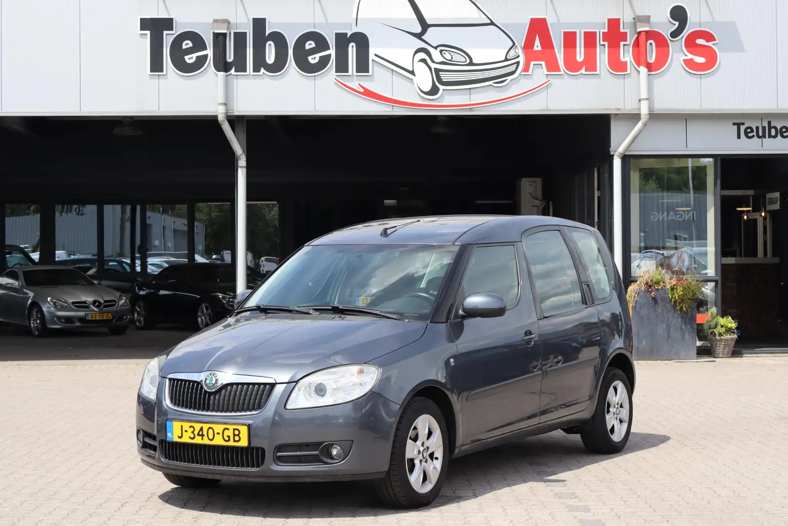 Skoda Roomster 1.4-16V Navigator Airco, Cruise control, Elektrisc Grijs - 1