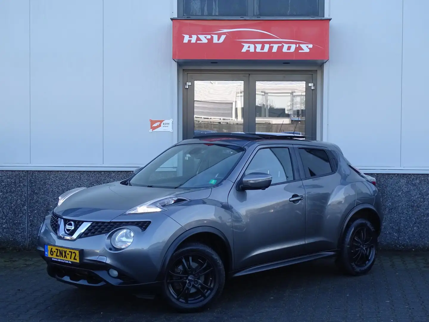 Nissan Juke 1.2 DIG-T S/S Tekna navi LEER 2e eig org NL Grijs - 1