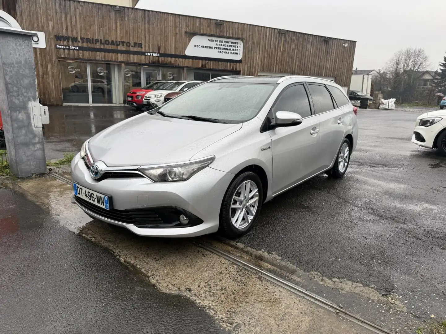 Toyota Auris Touring Sports Hybride 136h Bva Dynamic Gps + Clim + Camera AR Gris - 1