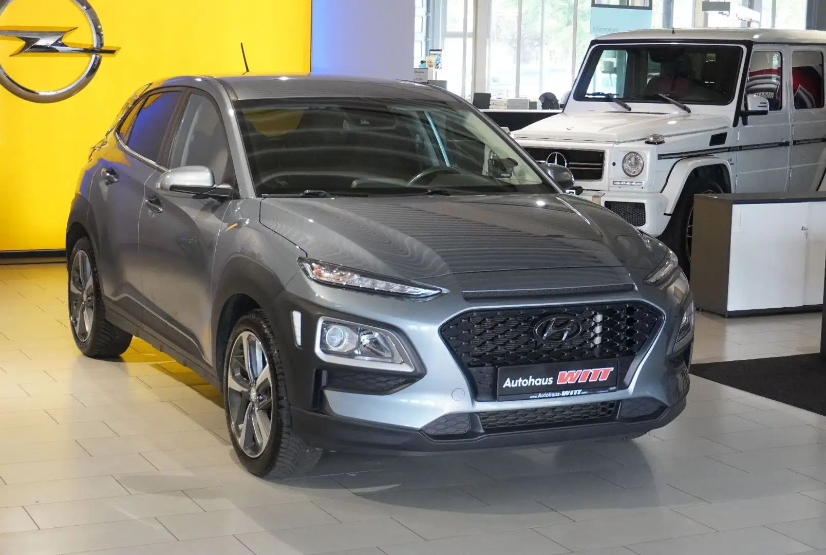 Hyundai KONA 1.0 T-GDI ~ACC~Klima~Bluet~Sitzhz~Scheckhf~ Grau - 1