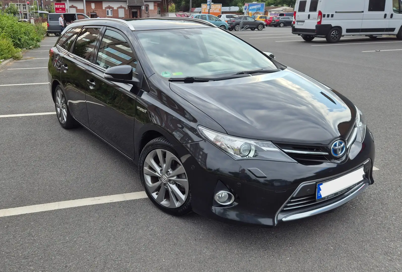 Toyota Auris Auris 1.8 VVT-i Hybrid Automatik Touring Sports Ex Schwarz - 1
