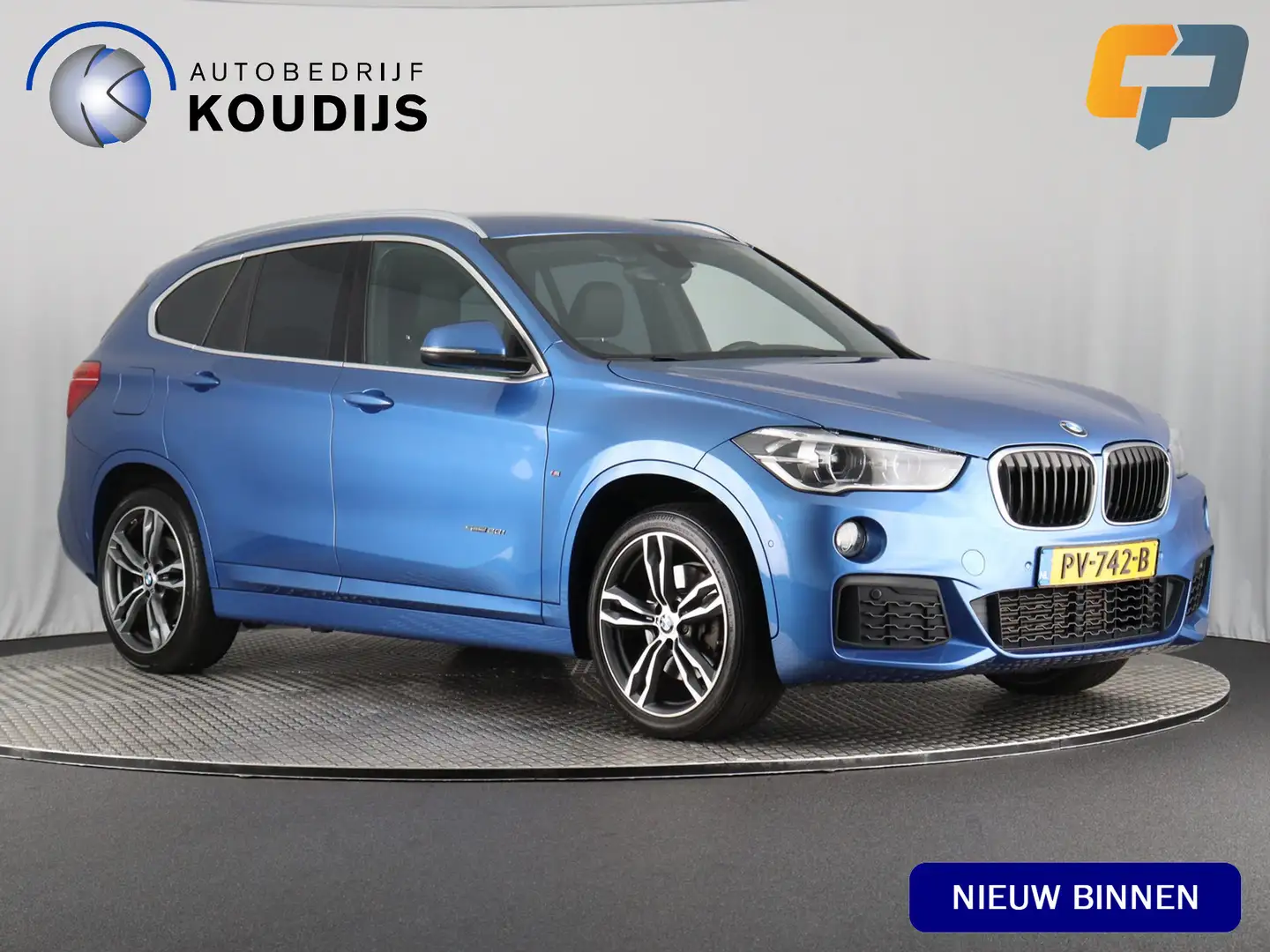 BMW X1 sDrive20i High Executive M Sport (NL-Auto / Afn. T Blauw - 1
