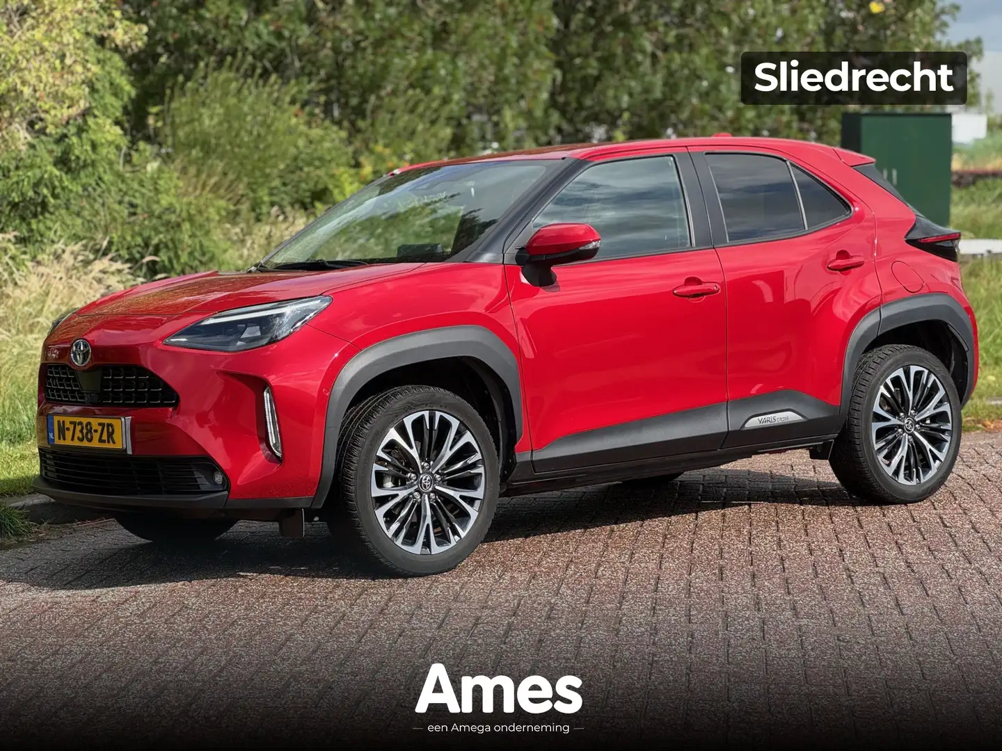 Toyota Yaris Cross 1.5 92pk AUT hybrid AWD Executive | Dodehoeksensor Rood - 1
