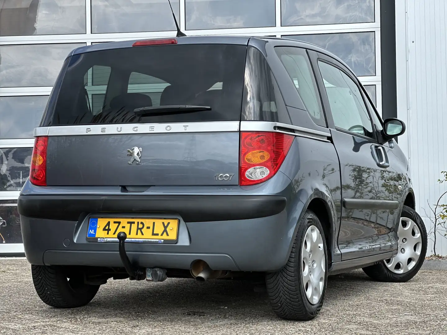 Peugeot 1007 1.4 Gentry 74pk | Airco | Elektrische ramen voor | Gris - 2