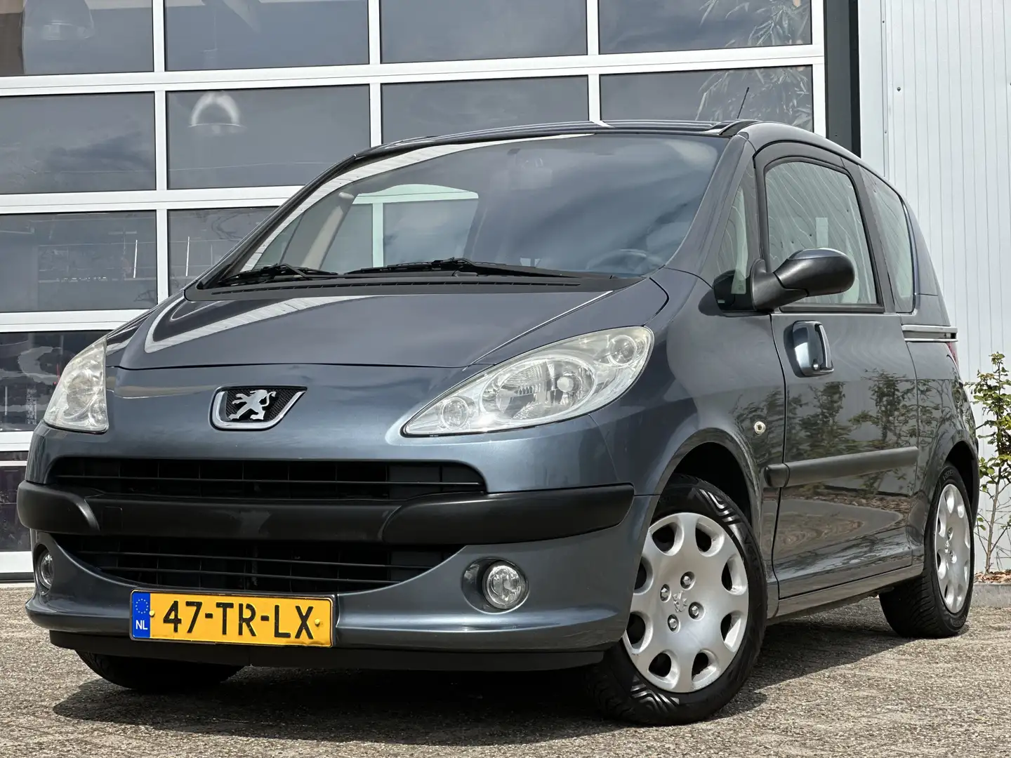 Peugeot 1007 1.4 Gentry 74pk | Airco | Elektrische ramen voor | Gris - 1