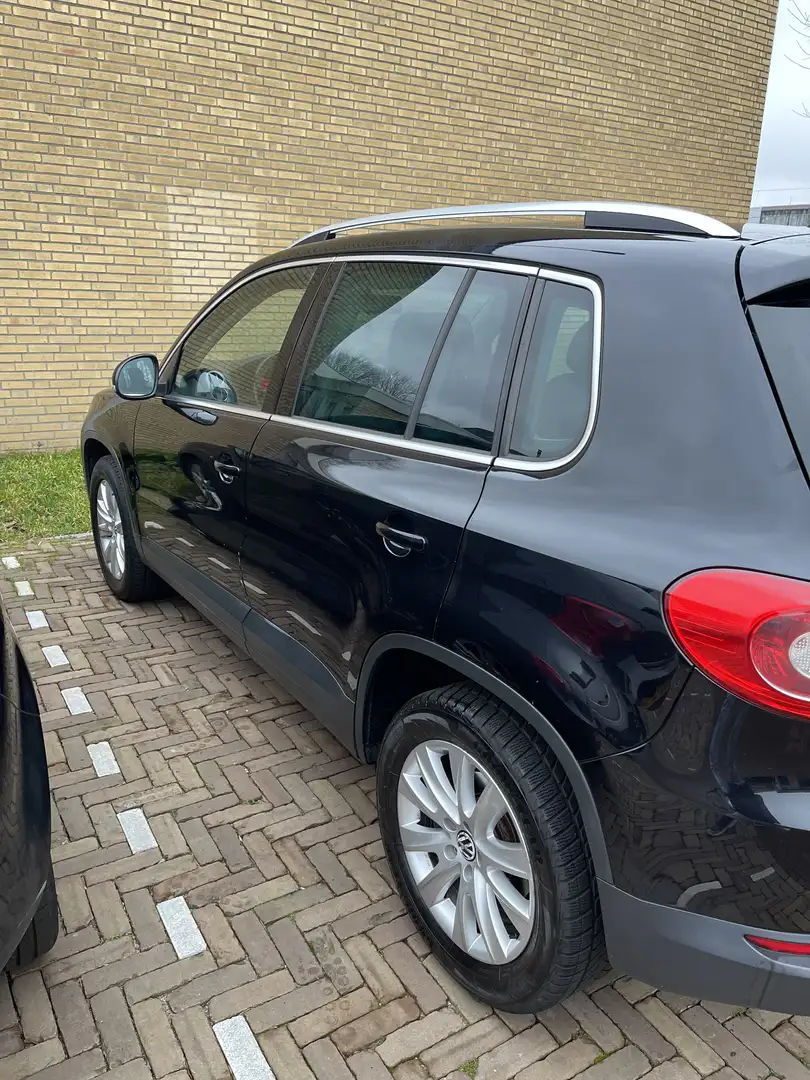 Volkswagen Tiguan 1.4 TSI Sport&St. 4M Zwart - 1